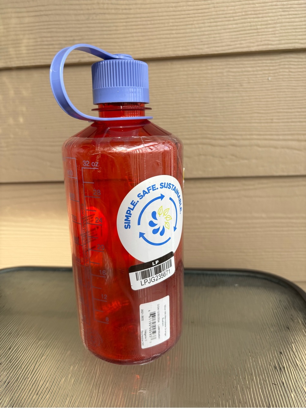 Nalgene Red Plastic Water Bottle with Purple Cap